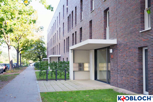 Mehrfamilienhausanlage mit rotem Klinkjer und Briefkastenanlage der Firma Knobloch.